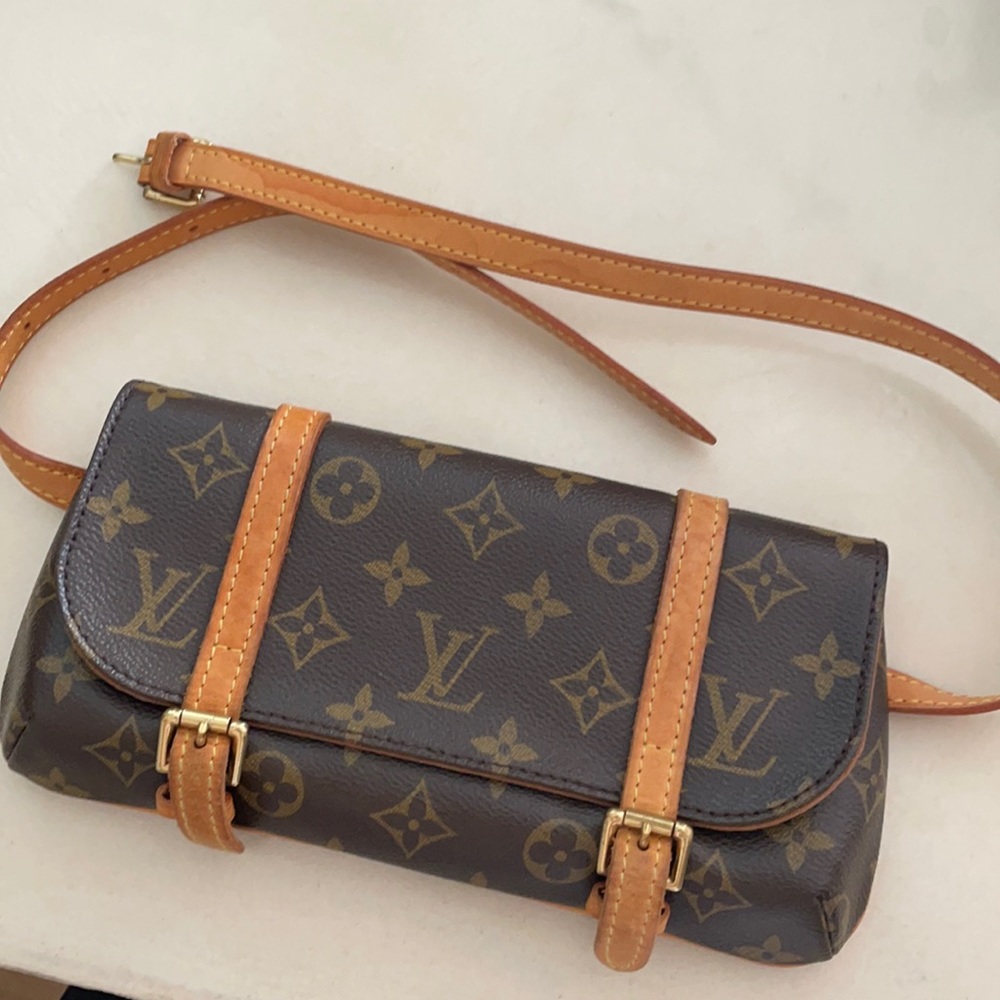 Louis Vuitton waist or clutch bag.